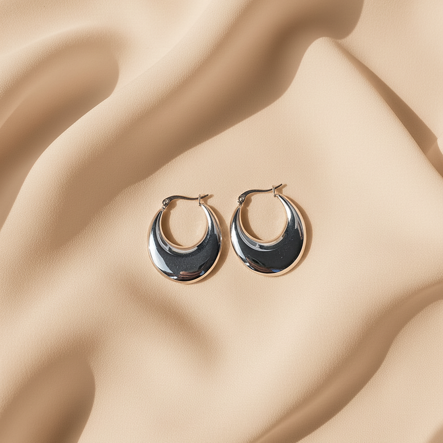 Onyx Hoops chunky sterling silver hoops with thick tapered wedge body and high-mirror finish on warm beige satin – waterproof non-tarnish 925 sterling silver hoop earrings