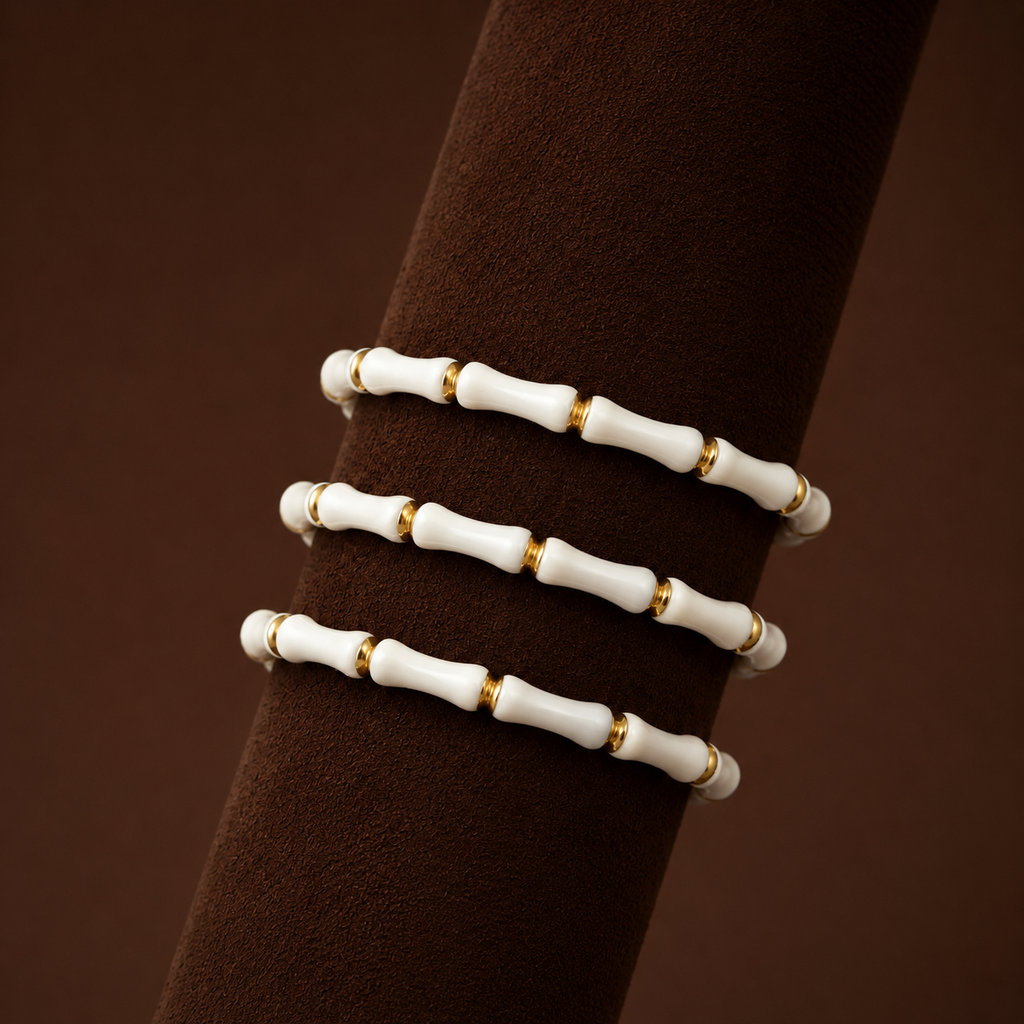 Bambi Bracelet set of three white bamboo bead bracelets with gold accents on display stand – stretch bracelet stack, non-tarnish waterproof hypoallergenic women's bracelet