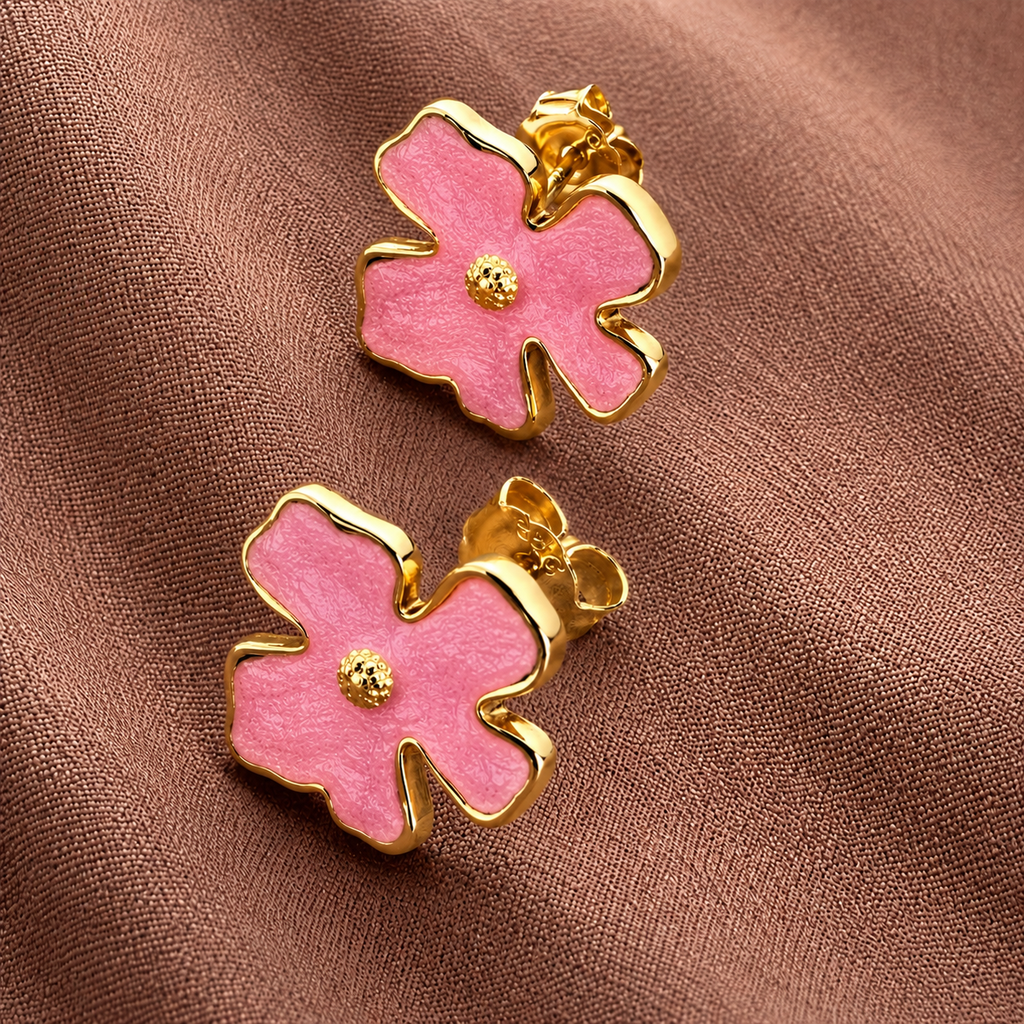 Bloomie Studs pink enamel flower stud earrings with gold wavy border and textured gold centre on warm fabric – hypoallergenic nickel-free non-tarnish stainless steel floral stud earrings