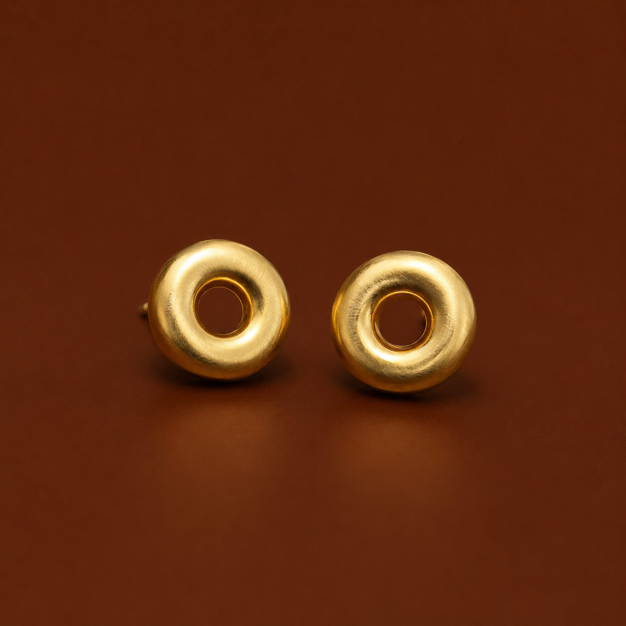 Chọ Studs gold stud earrings on rust background – round stud earrings, circle stud earrings, donut earrings stud earrings, waterproof gold earrings, earrings that don't tarnish