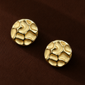 Chrysa Studs textured circular gold disc stud earrings with hammered cobblestone surface – hypoallergenic 316L stainless steel, tarnish-free and nickel-free for everyday and going-out wear