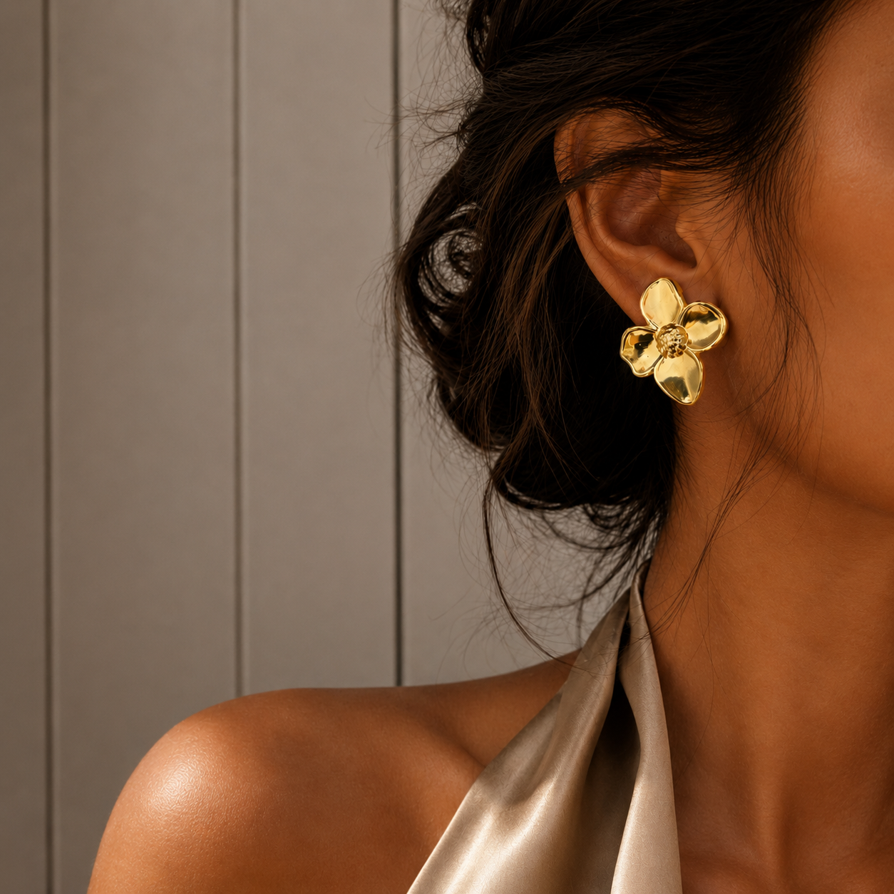 Dalia Studs polished gold flower stud earrings with textured centre worn by model – hypoallergenic non-tarnish stainless steel gold earrings for sensitive ears