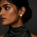 Demi Studs gold dome stud earrings worn by model – chunky oval gold studs for everyday wear hypoallergenic non-tarnish stainless steel