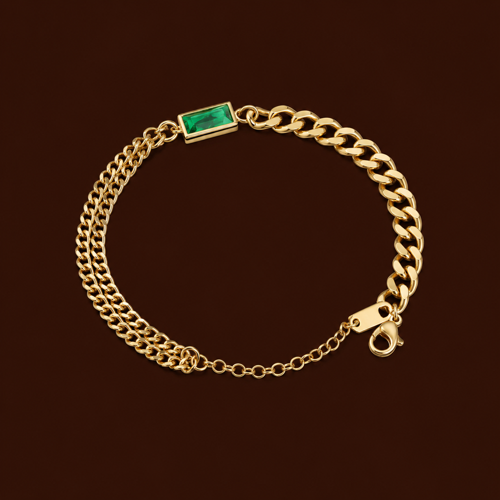 Esme Bracelet gold double curb chain bracelet with emerald green baguette cubic zirconia on dark background – non-tarnish waterproof hypoallergenic stainless steel women's bracelet