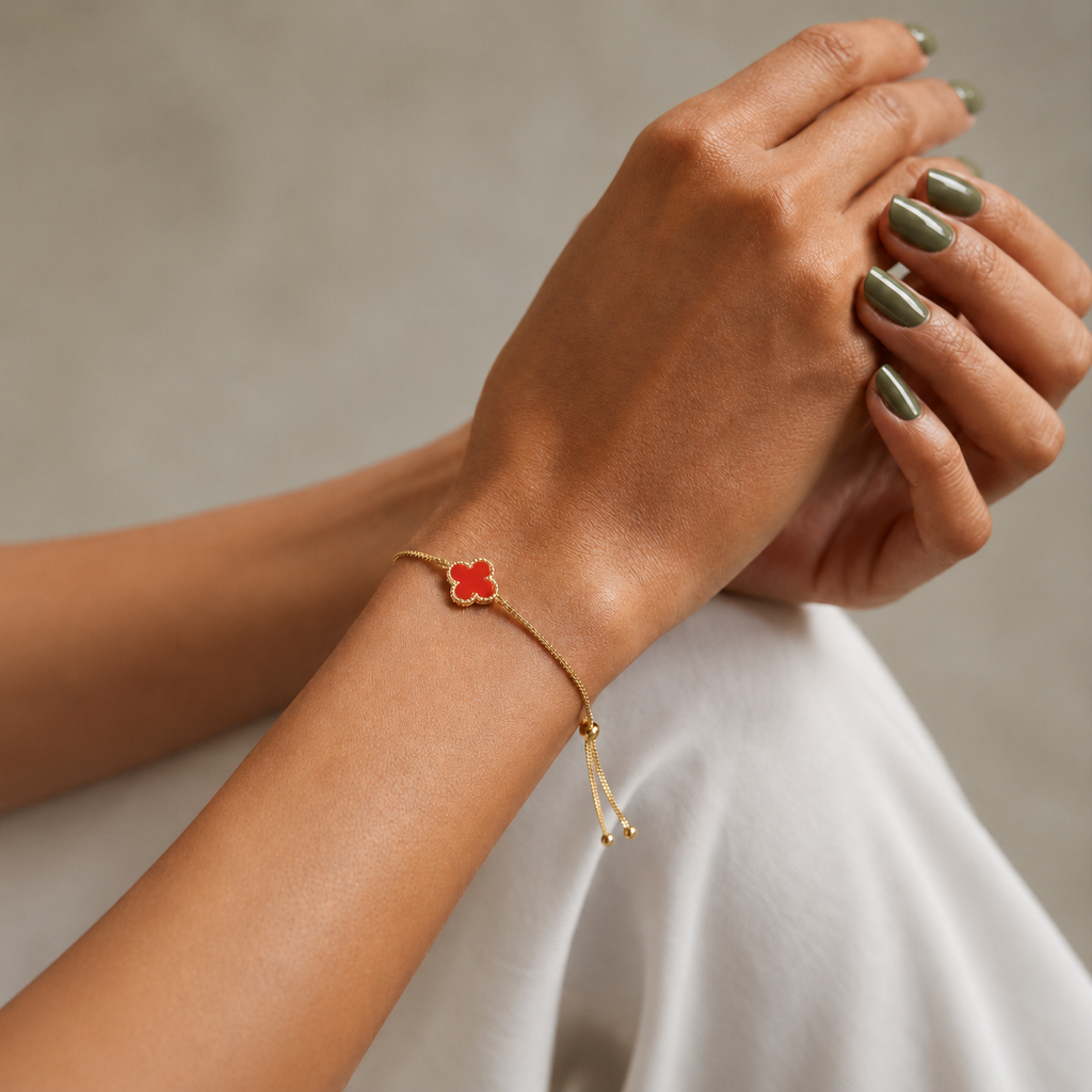 Fleur Bracelet red four leaf clover bracelet on wrist – dainty adjustable gold clover bracelet, hypoallergenic non-tarnish women's bracelet