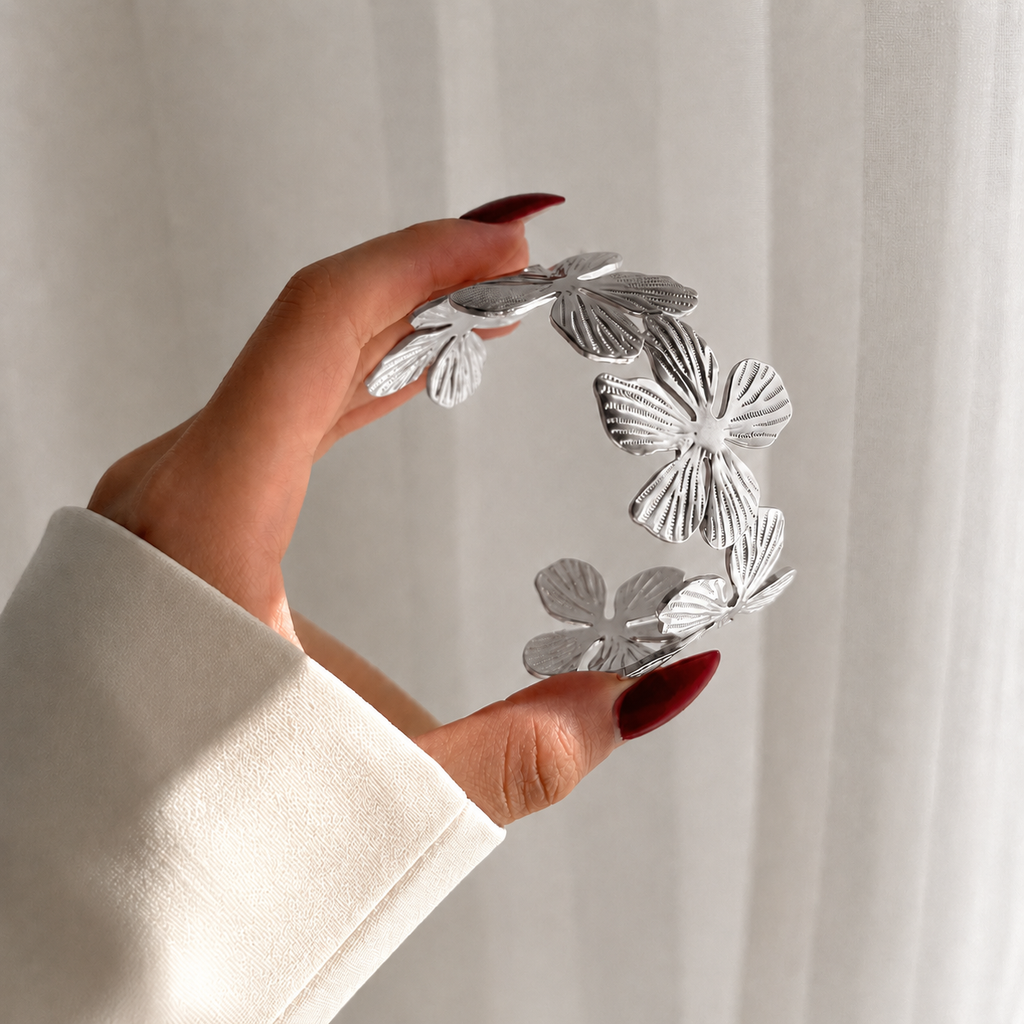 Flora Cuff silver statement bracelet held open – flower bracelet, floral cuff bracelet, open cuff bracelet, silver statement bracelet in layered petal detail