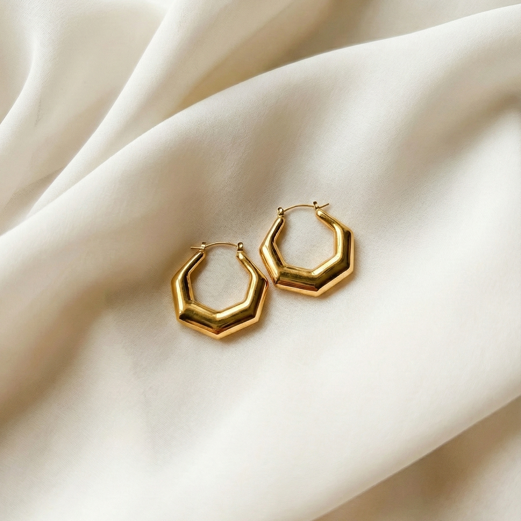 Hexa Hoops chunky gold hoop earrings with angular hexagonal silhouette on cream silk fabric – minimalist stainless steel hoop earrings non-tarnish waterproof