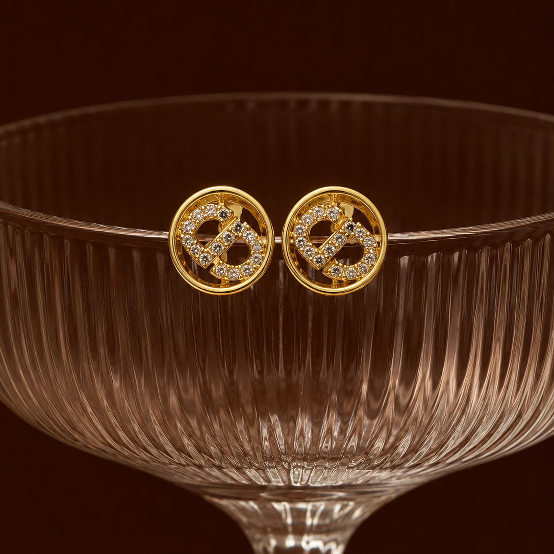 Kamsee Studs two way gold monogram earrings with pavé cubic zirconia letter design inside circular frame on cocktail glass – nickel-free surgical steel zirconia stud earrings