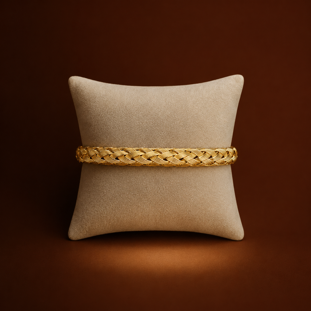 Koa Bracelet gold braided woven bangle on cushion display – stretch stainless steel bangle, non-tarnish waterproof hypoallergenic UK jewellery