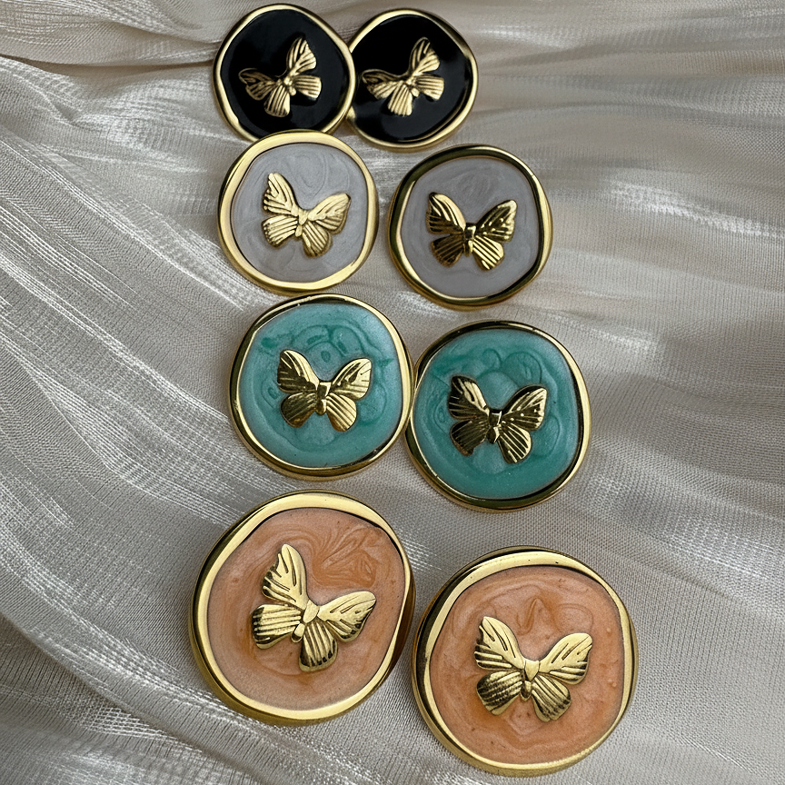 Kora Studs butterfly stud earrings in four colours – black, grey, teal and peach enamel disc earrings with gold butterfly charm, gift earrings set