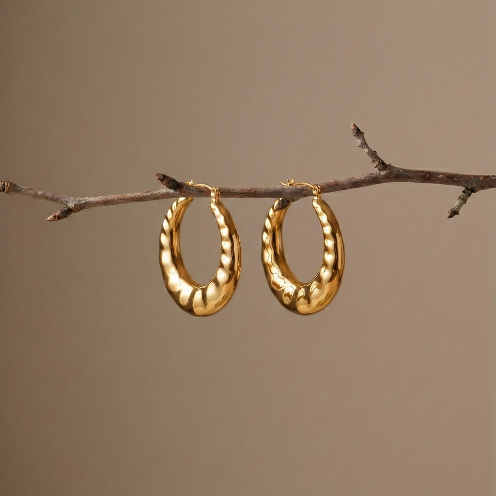 Lúlú Hoops chunky hoop earrings with bamboo earrings texture, hanging from a natural tree branch – bamboo hoop earrings, hypoallergenic hoop earrings in gold finish