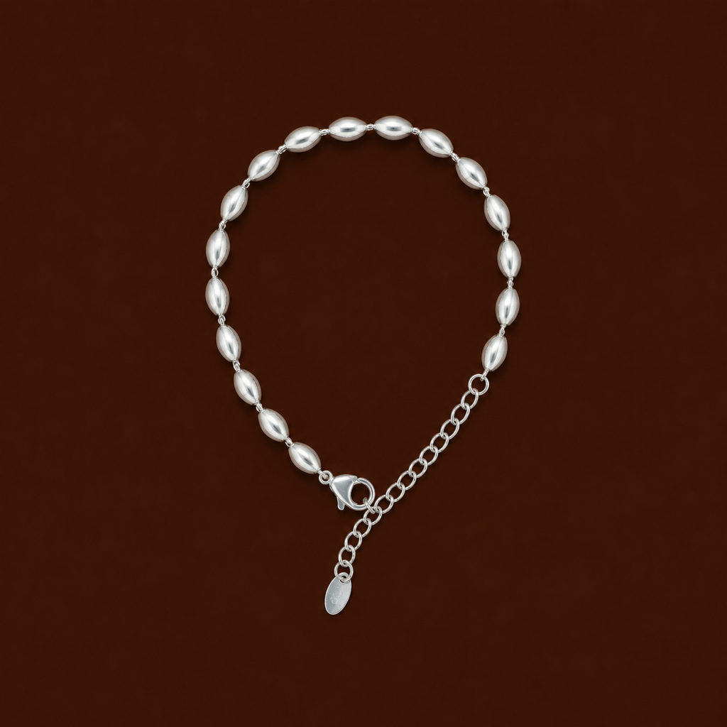 Mee-Mee Bracelet silver oval bead bracelet on dark background – dainty adjustable silver beaded bracelet, non-tarnish waterproof hypoallergenic stainless steel women's bracelet
