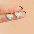 Mio Studs pearl heart stud earrings with blue mother of pearl centre and textured hammered gold border – hypoallergenic waterproof nickel-free stainless steel heart earrings