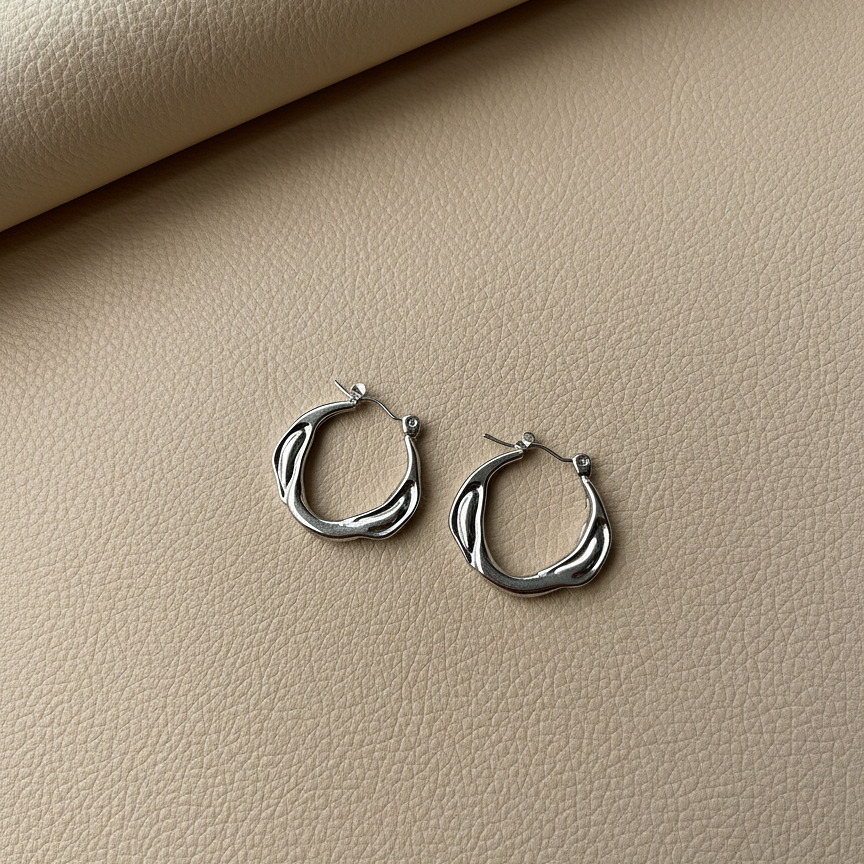 Nami Hoops wavy earrings on cream leather – silver hoop earrings with textured hoop earrings detail, sterling silver earrings, waterproof earrings, non tarnish earrings