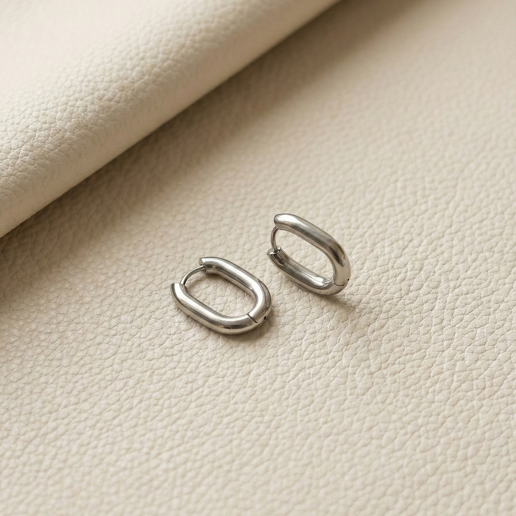 Nné Hoops silver oval hoop earrings with architectural rectangular curve – waterproof non-tarnish stainless steel huggie earrings