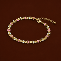 Petra Bracelet gold leaf chain bracelet with alternating pink and blue enamel on dark background – adjustable colourful enamel bracelet, waterproof hypoallergenic UK jewellery