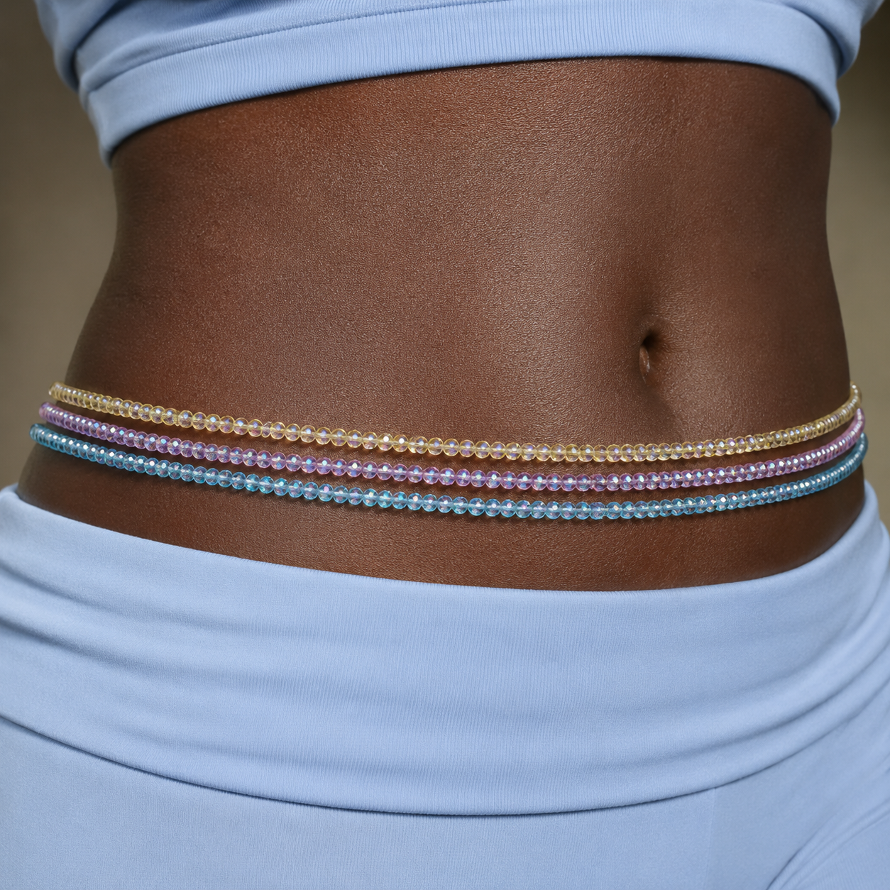 Model wearing RiRi Waist Beads in pastel set on dark skin – african waist beads, body jewellery uk, intimate jewellery for daily wear