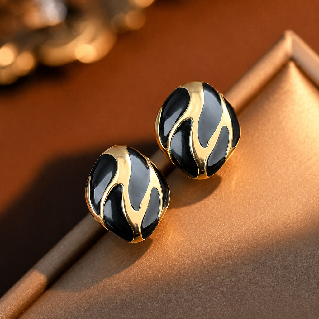 Riva Studs black and gold enamel swirl oval stud earrings with bold wave detail – hypoallergenic nickel-free stainless steel non-tarnish everyday earrings