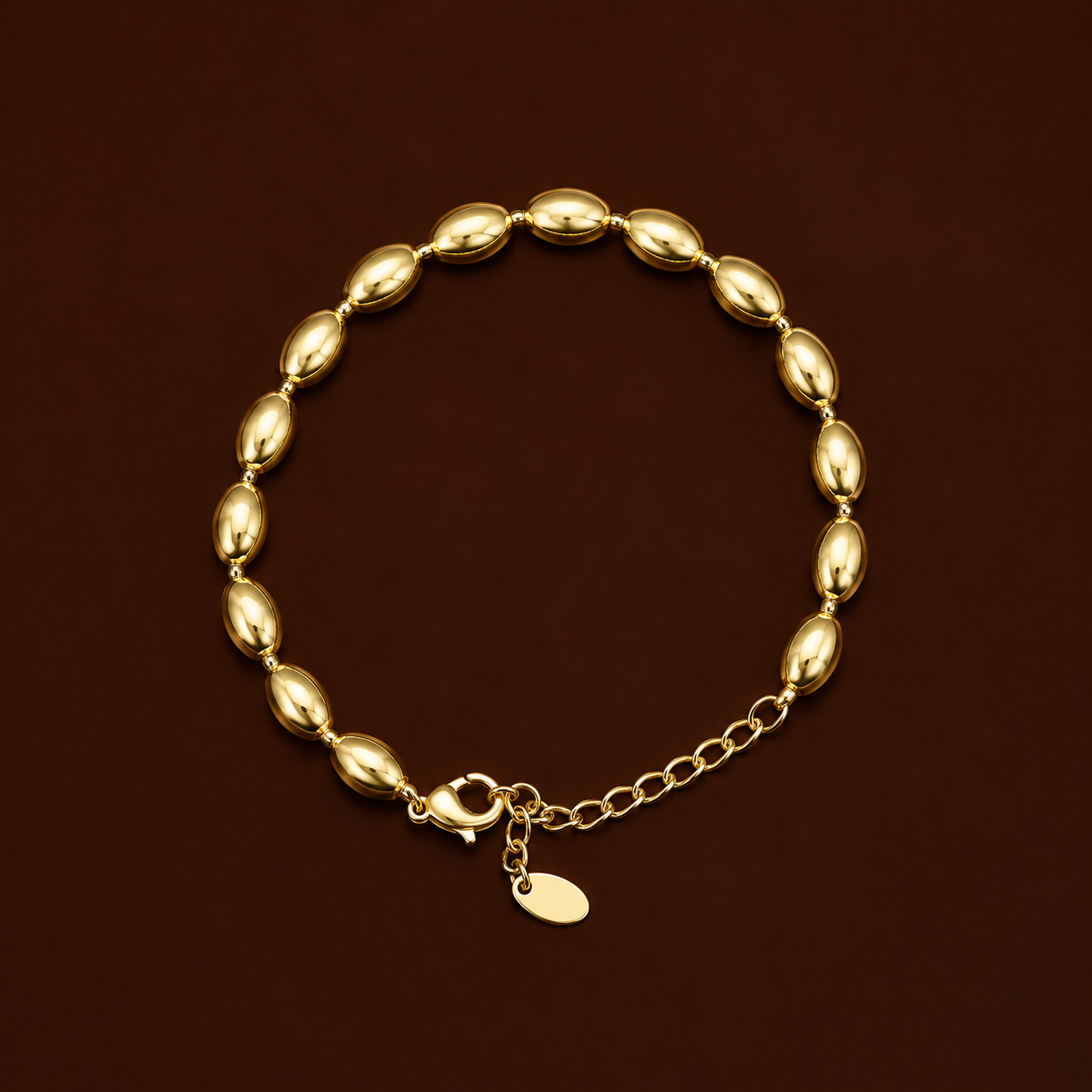 Ro Bracelet gold oval bead bracelet on dark background – adjustable stackable gold beaded bracelet, non-tarnish waterproof hypoallergenic stainless steel women's bracelet