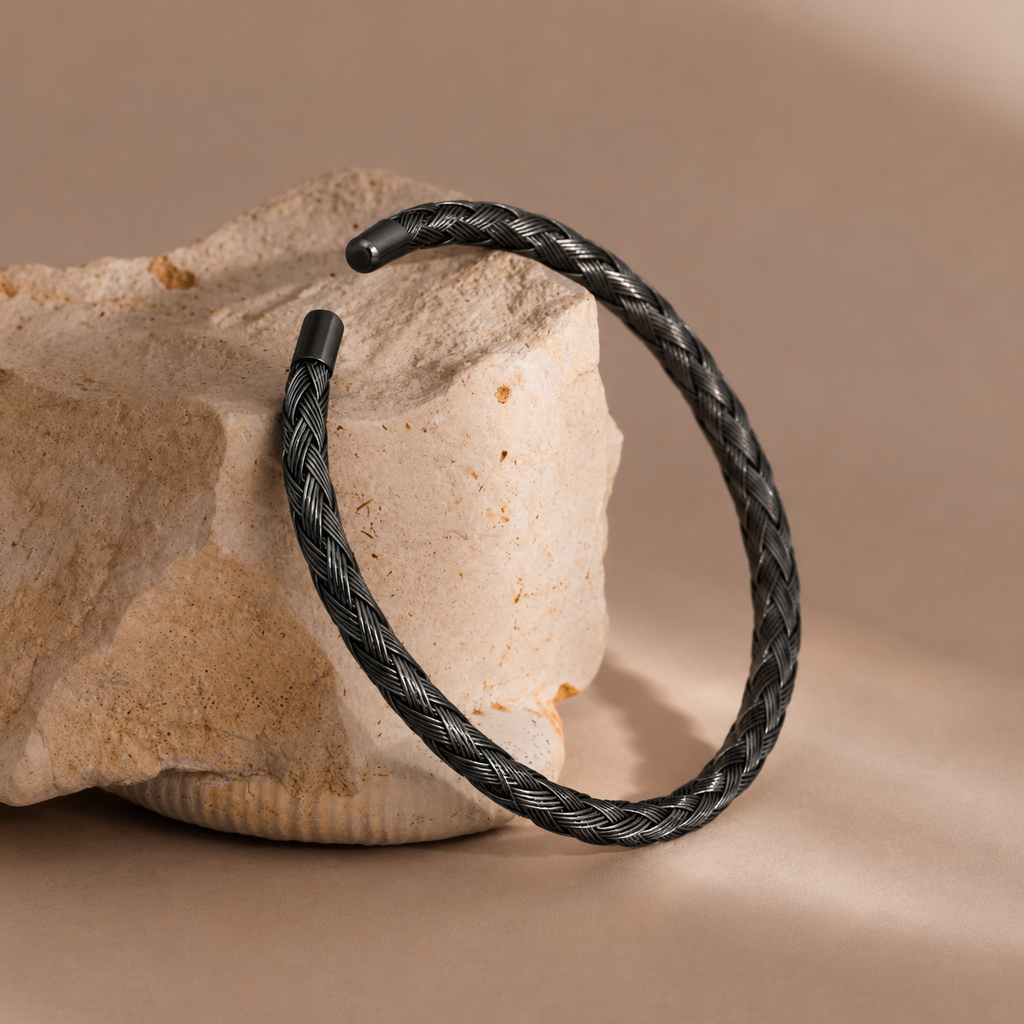 Sira Cuff black braided woven wire open cuff bracelet on stone display – non-tarnish waterproof hypoallergenic stainless steel women's cuff bracelet