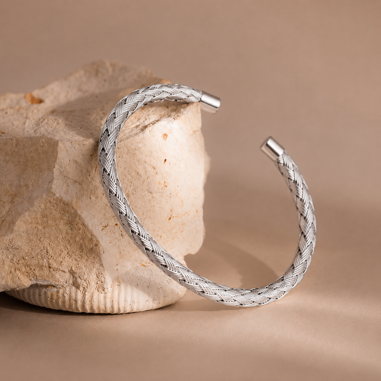 Sira Cuff silver braided woven wire open cuff bracelet on stone display – non-tarnish waterproof hypoallergenic stainless steel open bangle women's bracelet