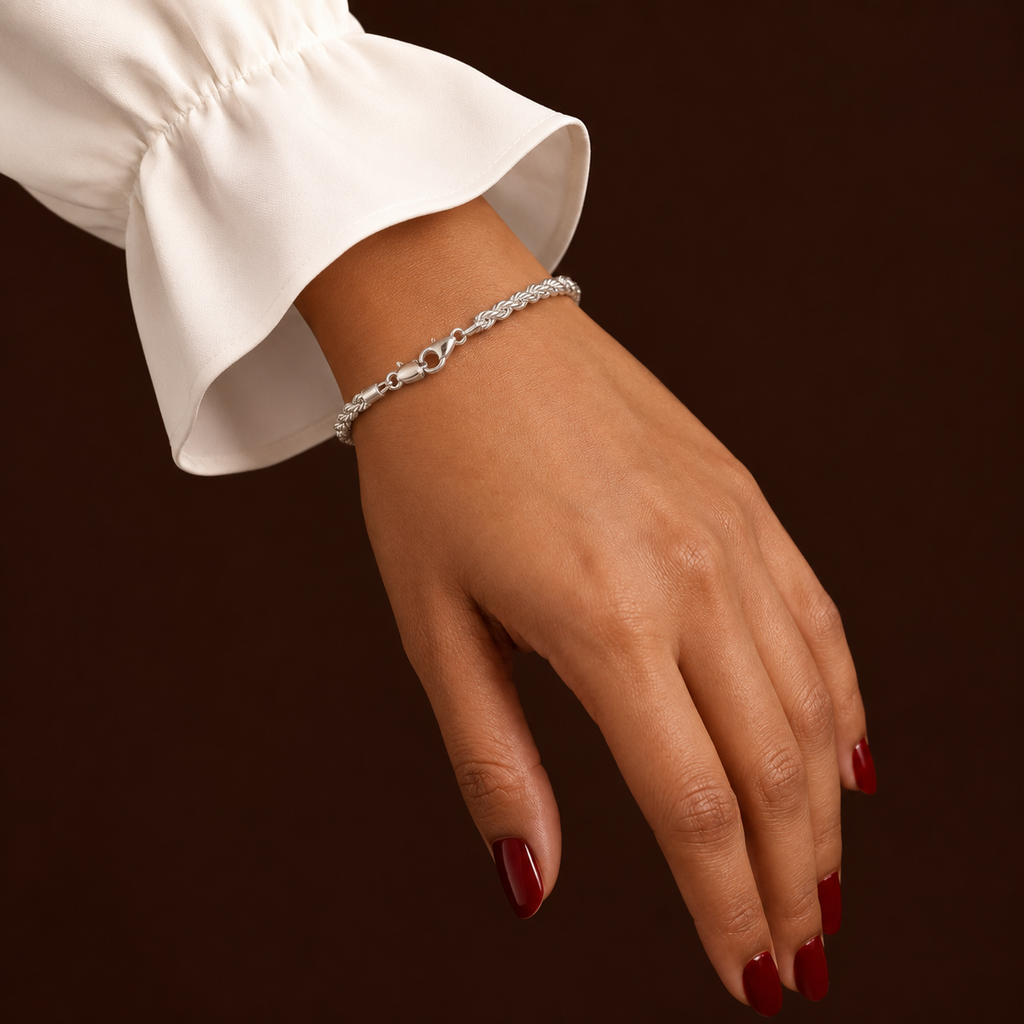 Tessa Bracelet silver rope chain bracelet worn on wrist with white sleeve – minimalist twisted silver bracelet, non-tarnish waterproof hypoallergenic stainless steel women's bracelet