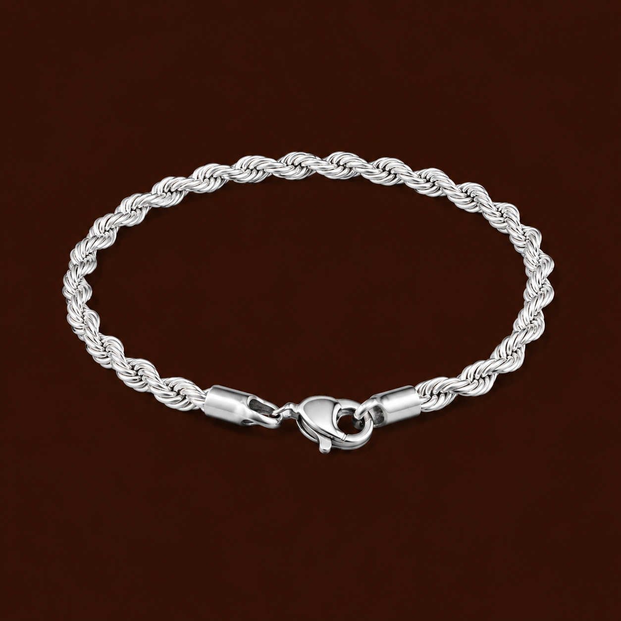 Tessa Bracelet silver twisted rope chain bracelet on dark background – stackable silver chain bracelet, non-tarnish waterproof hypoallergenic stainless steel women's bracelet