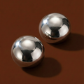 Xena Studs silver polished stainless steel stud earrings shown on cream background – hypoallergenic dome stud earrings, tarnish free and waterproof for everyday wear