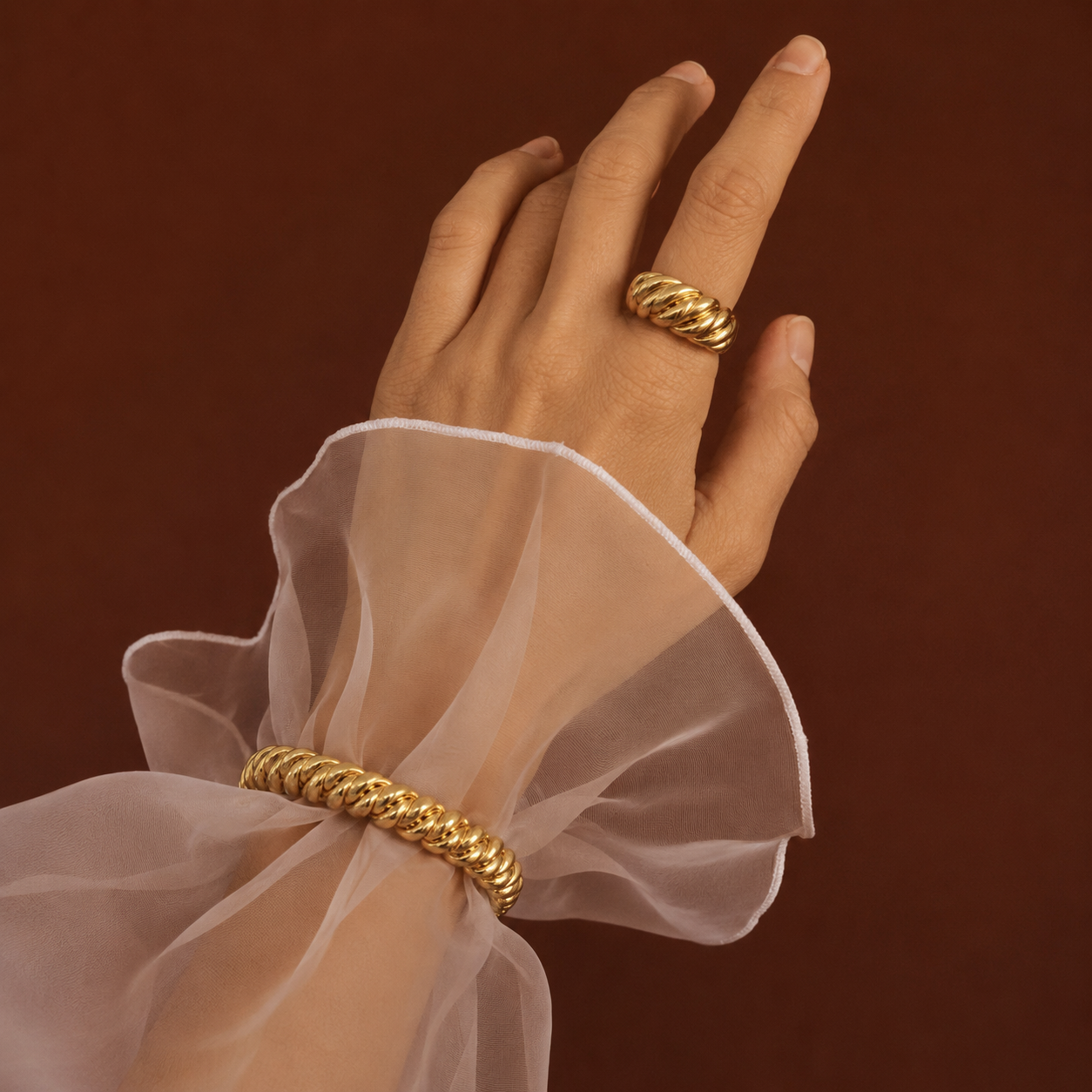 Zena Bracelet gold twisted rope bangle worn on wrist with matching ring – statement gold bracelet, waterproof non-tarnish hypoallergenic stainless steel UK jewellery